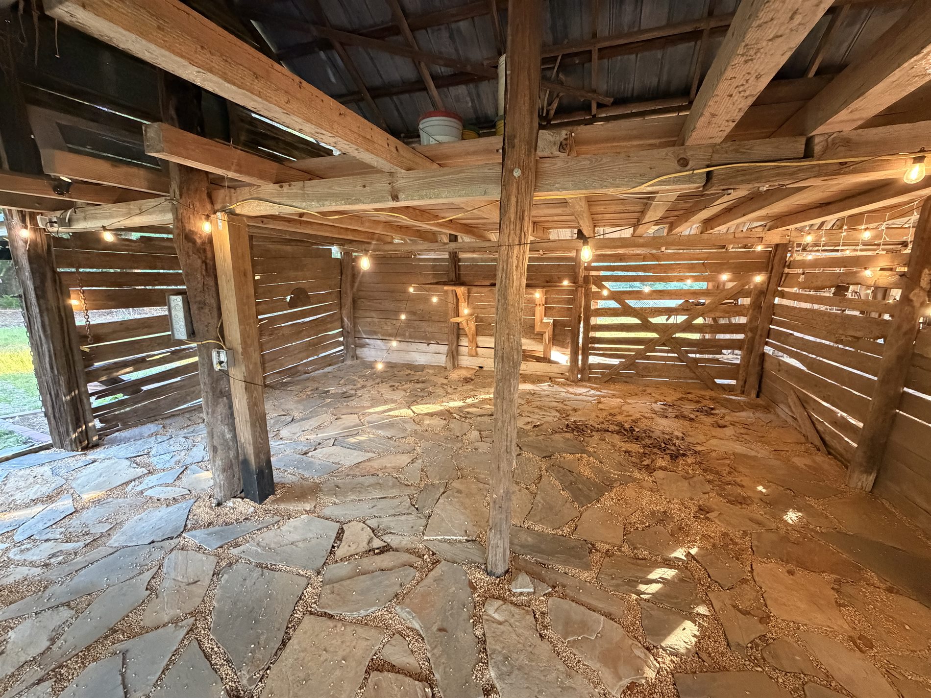 Historic barn interior with rustic lighting and cypress timber