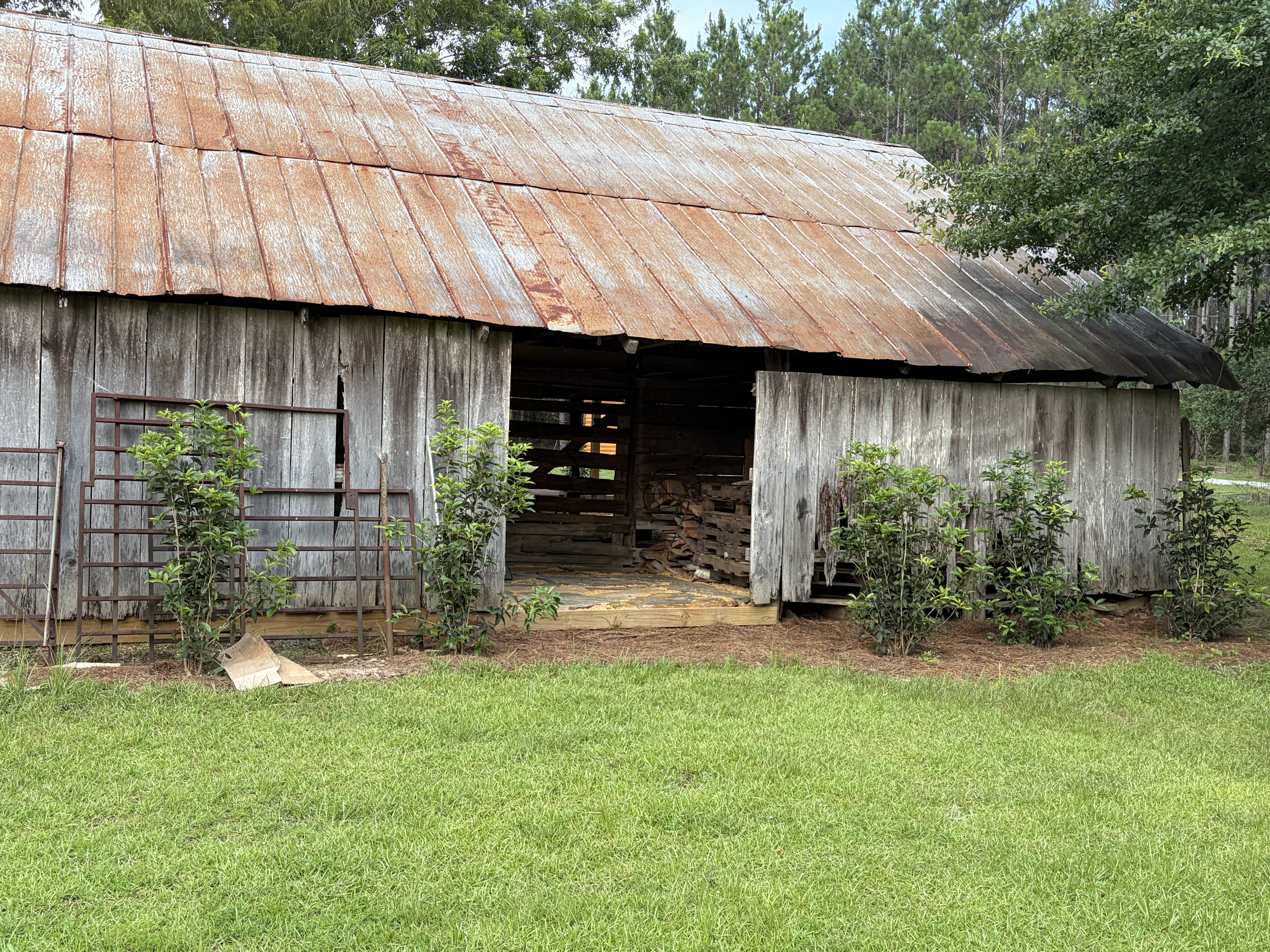 Historic cypress barn exterior for rustic event photo backdrops