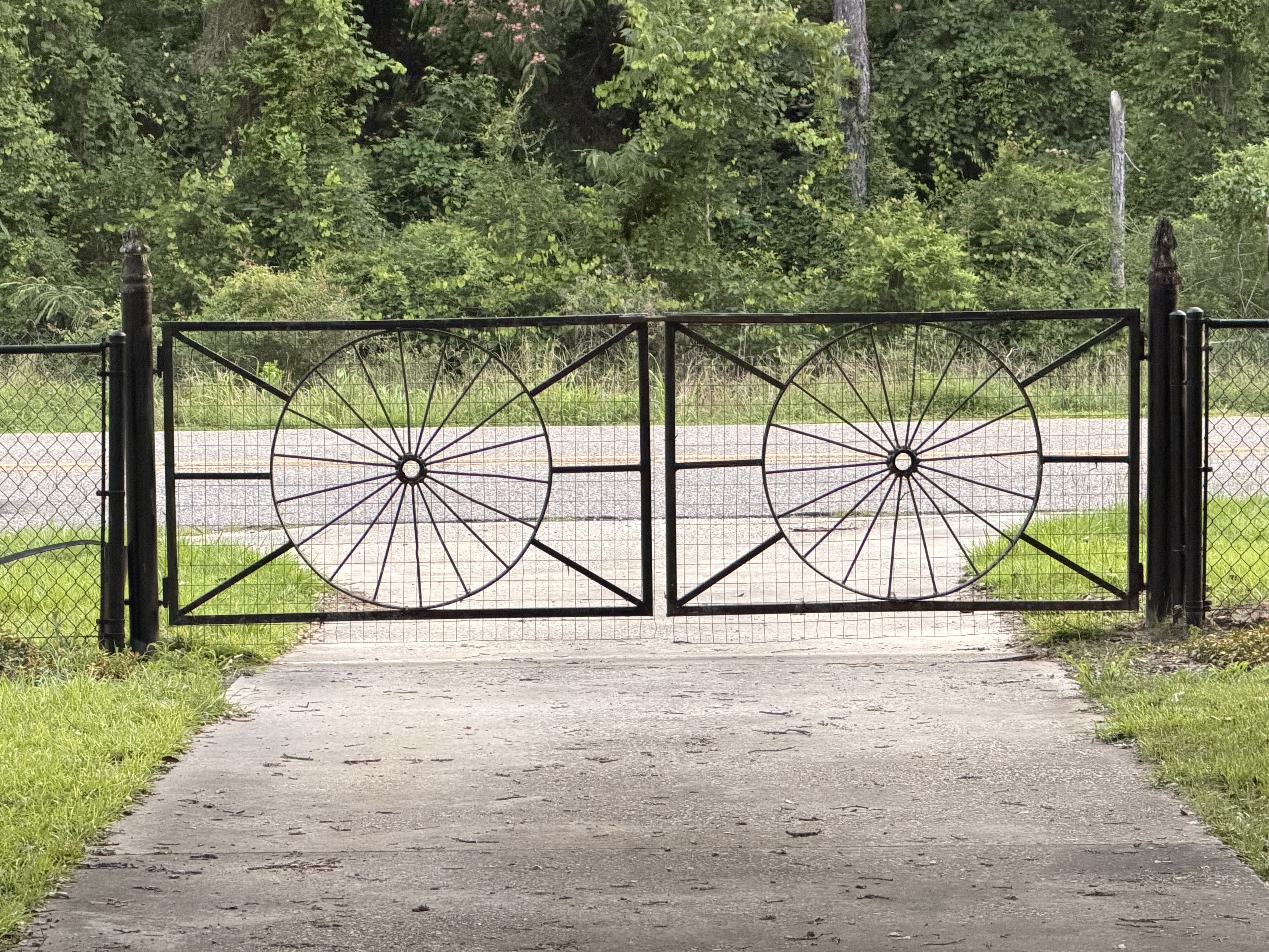 Rustic JaxFarm entrance gate near forest setting